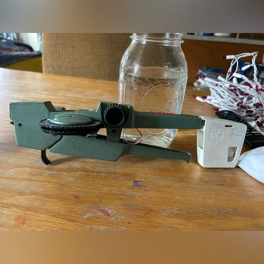 Apsco label maker with two rolls of red tape